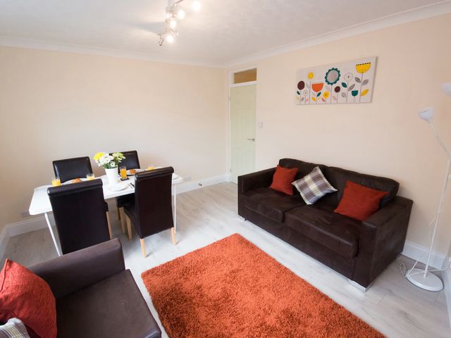 A living room with a dining table and chairs at 53 Hampton Road, Scarborough