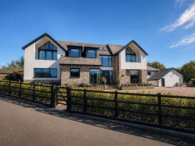 A house with large windows and a garden at Rochester Retreat Spacious 5 Bedroom House in Higham