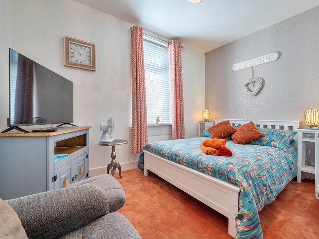 A bedroom with a bed and television at the property in an unspecified location