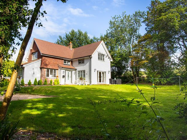 A house with a garden and trees in Battle