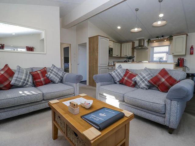 A living room with sofas and a coffee table at Lakeland Lodge 3Bed 2 Bath Private Patio Carnforth