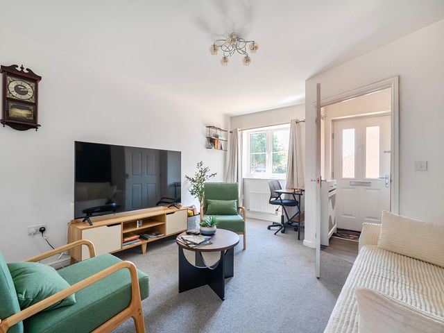 A living room with a sofa, coffee table and television at House Sleeps 6 Enclosed Garden Pet Friendly Bridgwater