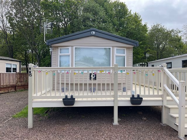 A mobile home with a deck and steps at W15 in Builth Wells