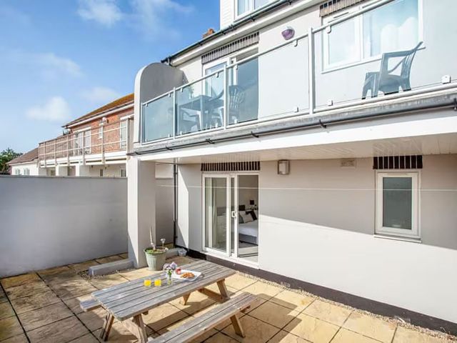 An outdoor area with a table and chairs at Spacious 3 Bed House Sleeps 6 Parking Wifi in Newquay