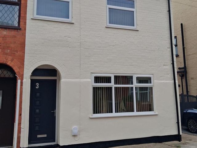 A building facade with door and windows at a residential property