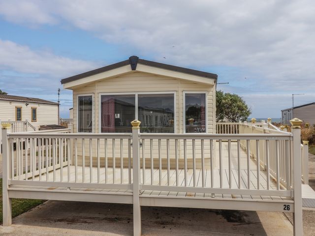 A holiday home with a deck at Paws and Relax in 
