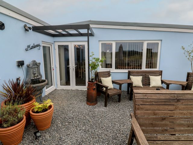 An outdoor area with seating and a fountain at The Hideaway at Monterey Helston