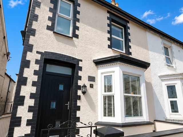 A house exterior with a front door and windows at Number 8 Llandudno