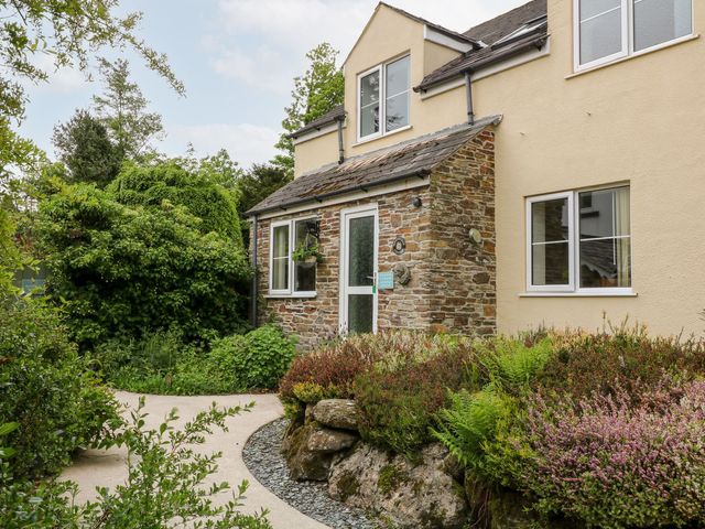 A house with plants and a pathway at Honeysuckle in Tavistock