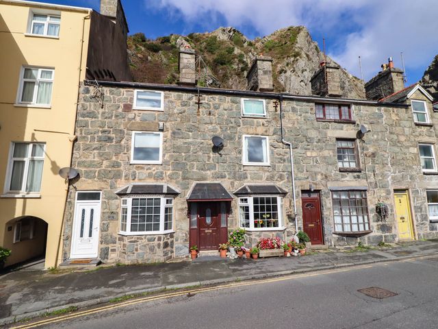 A stone building with multiple doors and windows at 1 Glanaber Terrace