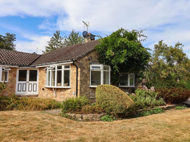 A house with windows and garden at 12 The Dell in Leeds