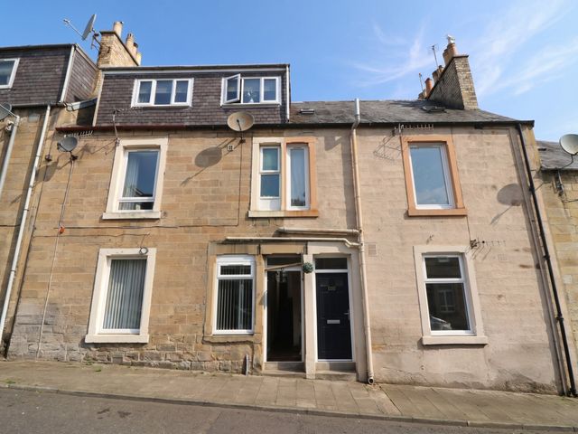 A building with windows and front door at Hill View Studio in Hawick