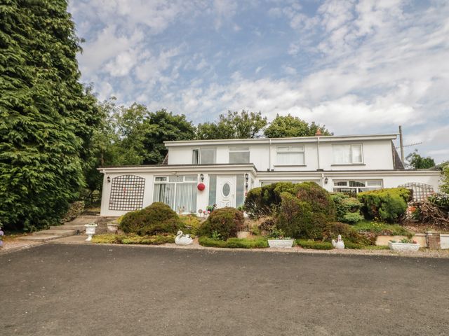 A house with windows and garden at Mourne Mountains View in Dunmurry