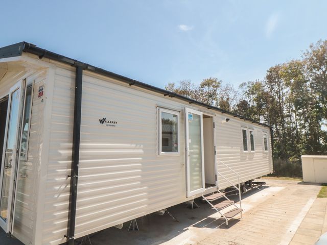 A mobile home with steps and entrance at 14 Pines in Cayton Bay