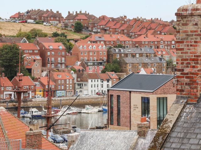 A view of houses and boats in Whitby Harbor at 14 Brunswick Street Whitby