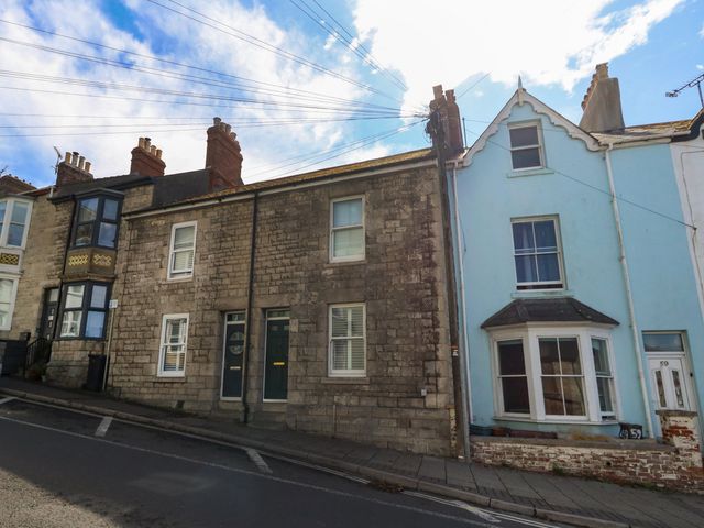 A street view of residential buildings at 57 High Street in Portland