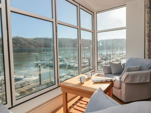 A living room with view of marina at 33 Dart Marina in Dartmouth