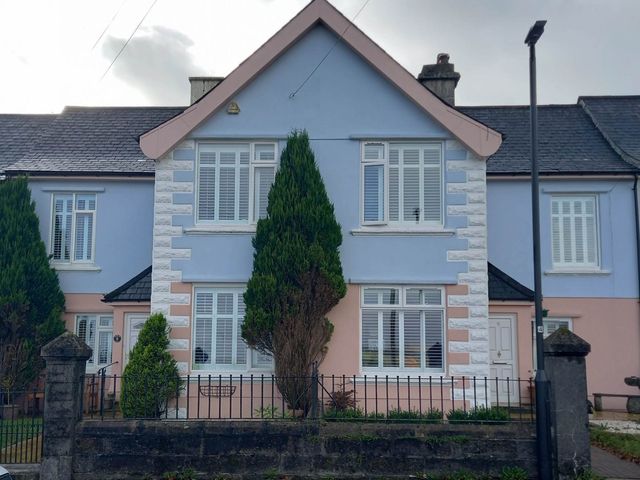 A house with trees and a fence at Angels Place in Princetown