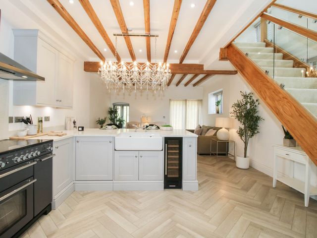 A kitchen with a stove and sink at The Hayloft in Birmingham