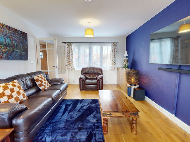 A living room with a leather sofa and coffee table at 5 Bedroom Home Sleeps 16 Ideal for Groups in Epworth