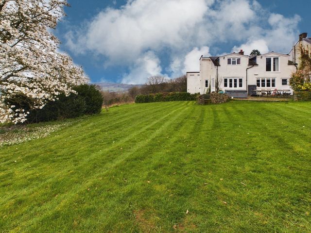 A house with a garden and lawn at Country House 14Guests Parking HotTub AmazingViews in Kilgwrrwg near Chepstow
