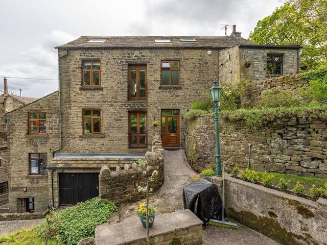 A stone house with multiple windows at OldMill 2Bed Sleeps6 PrivateGarden OptionalHotTub, Oakworth