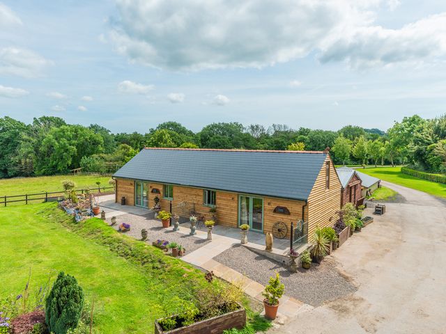 An outdoor view of a barn with plants around at Paddock View Barn 1Bed Sleeps 4 with Parking Duffryn Lloff Farm near Cowbridge