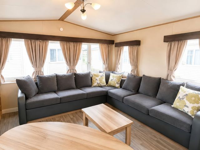 A living room with a sofa and coffee table