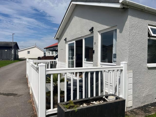 An exterior view of a house with a fence and pathway at Seaside Escape 2Br Sleeps4 Parking PetsOK Fireplace in Bridlington