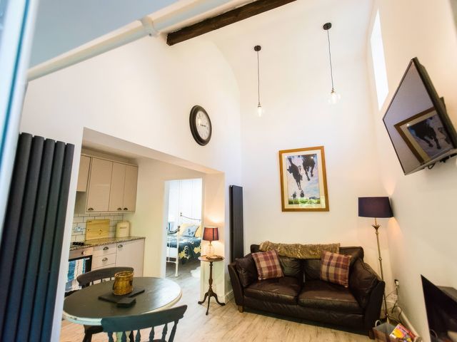 A living room with a sofa and coffee table at Oakley Country Retreat1 Bed Garden Free Parking, Nantwich