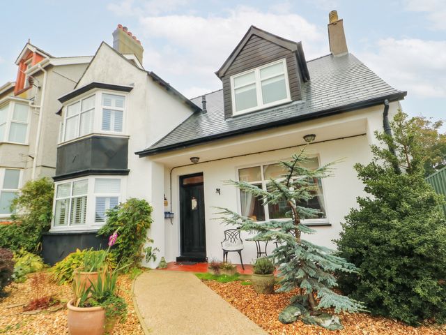 A house with a pathway and plants at 11 Bryn Goleu Avenue North Holyhead