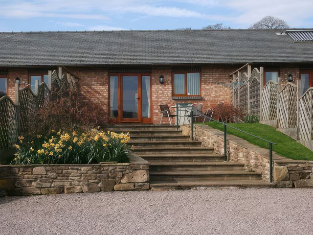 An outdoor area with steps leading to a brick building at Russet in Worcester