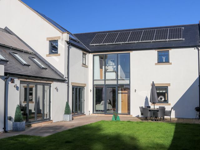 An outdoor area with seating and greenery at Northumberland Luxury Stays - The Chivits near West Chevington