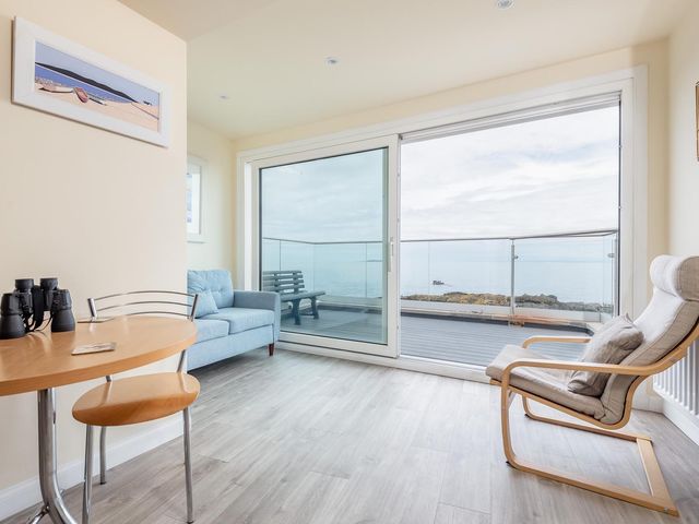 A living room with a sofa and table at Cellardyke 3-Bed House, Sleeps 6 with Sea Terrace in Cellardyke