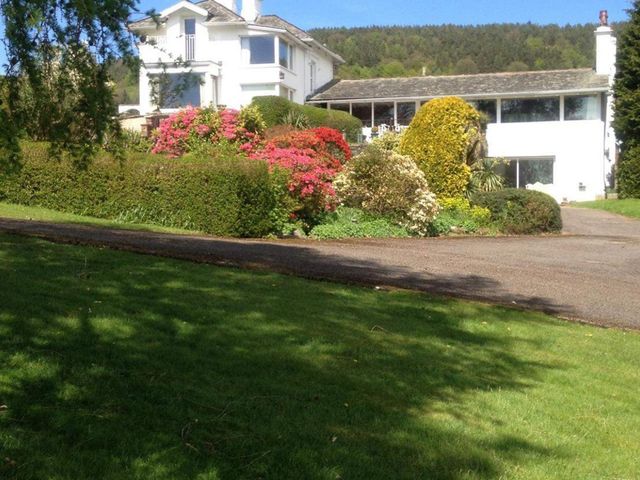 A house with a garden and driveway at Apartment Sleeps 2 with Parking, Pets Welcome, Watermillock near Pooley Bridge