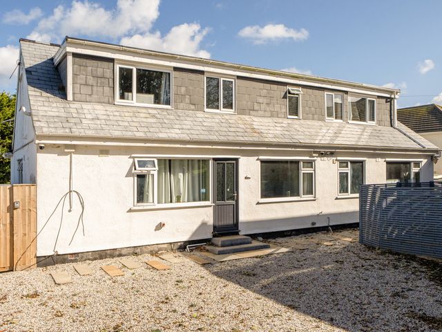 An outdoor view of a house with windows and door at 1 Bedroom Apartment, sleeping 3 with balcony and pet friendly, Carbis Bay