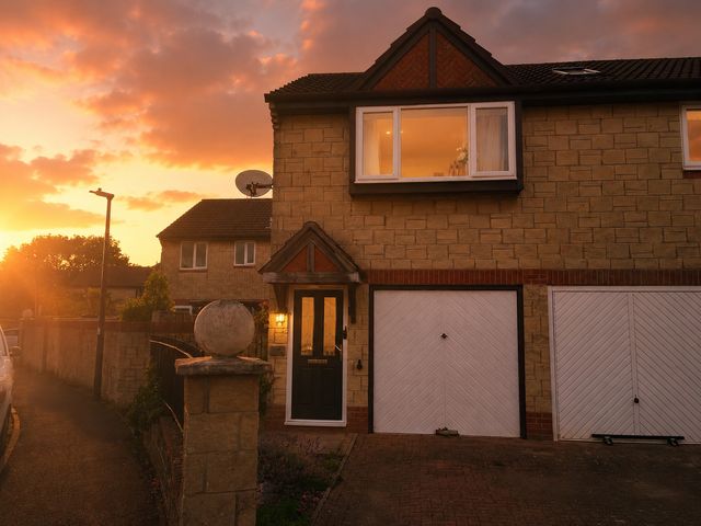 A house with a front door and garage at Family Friendly Coach House - Parking - Sleeps 4 Ebdon