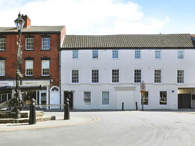 A street view showing buildings and a lamp post at Sleeps 2 in a Central Location and is family friendly, Retford