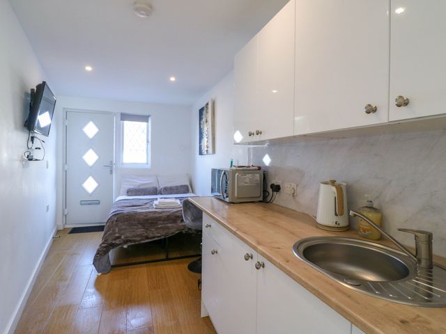 A studio with a bed and kitchenette at Annex in Southend-On-Sea