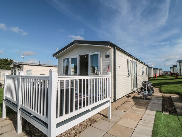 A house with a deck and lawn area at 10 Gosling in Scarborough