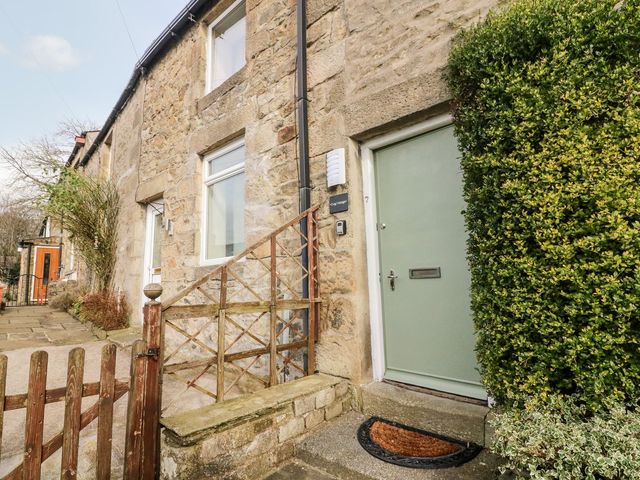 Front entrance with a door and stairs at Crag Cottage in Settle