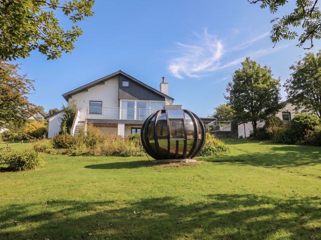 A house with a garden and a glass structure at 10 Rayrigg Rise Bowness-On-Windermere