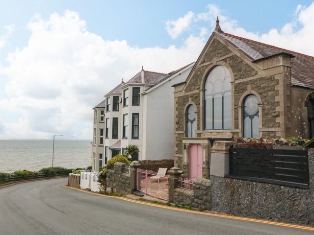 A building next to the ocean at Chapel of Arts in Criccieth