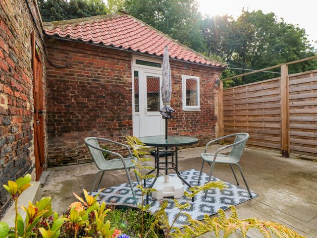 A patio area with a table and chairs at The Guest Room in Redcar