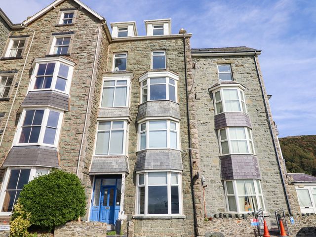 A building with stone exterior and multiple windows at Flat 4 Greenfields Barmouth
