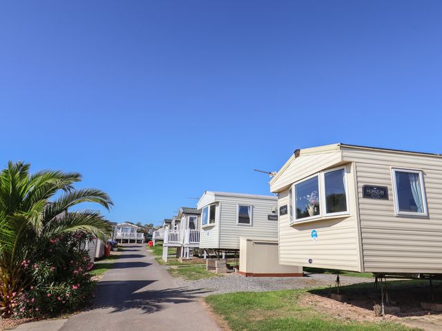Caravans lined along a pathway at Spruces 30 Sandy Bay, Exmouth