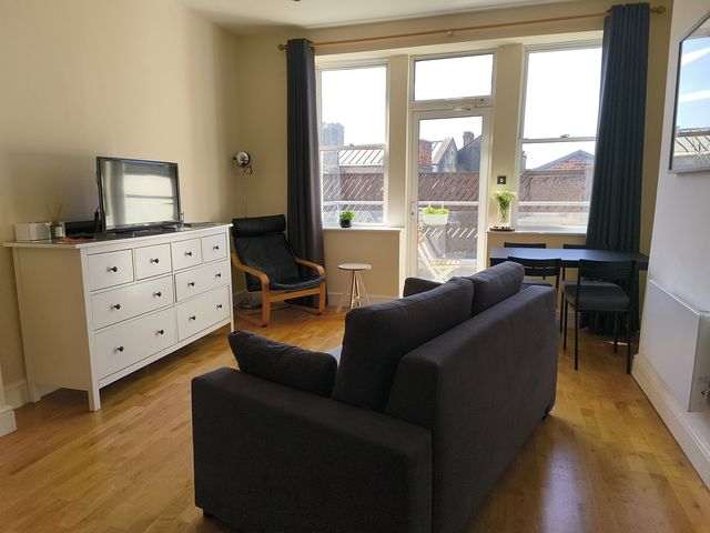 A living room with a sofa and television at Cardiff Apartment, sleeps 6, Castle and Stadium nearby, Cardiff