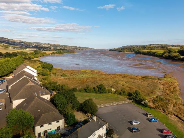 A view of a river and houses at Tor in Kingsteignton