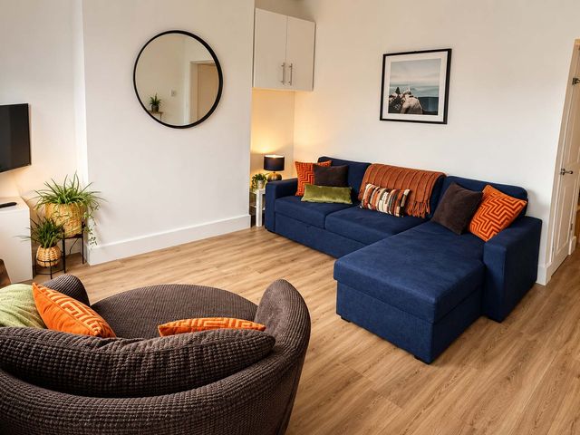 A living room with a sofa and an armchair at 2 Bed House in Creswell, Sleeps 7 with Street Parking, Creswell