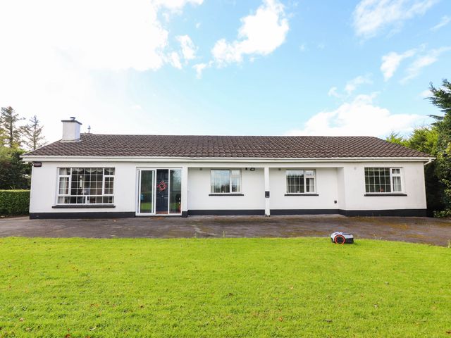 A front view of a house with a garden at Cross Beg Kilmihil, County Clare